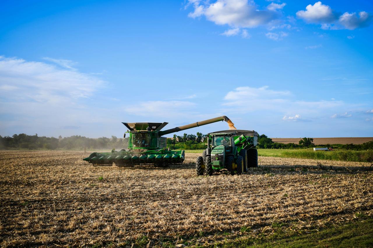 a tractor is driving in the middle of a field